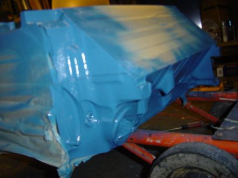 1979 Ford Bronco - A blue painted engine block is shown on an orange stand, likely during a rebuild or restoration process.