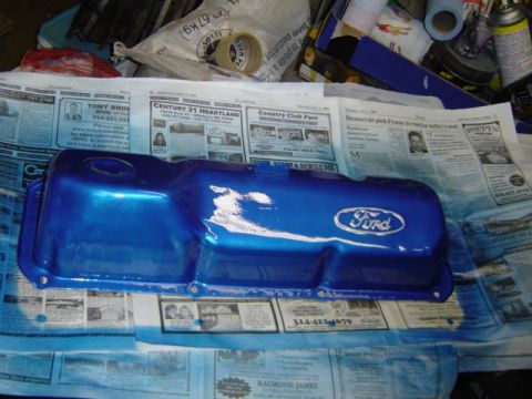 1979 Ford Bronco - Blue Ford valve cover with Ford logo, likely being painted.