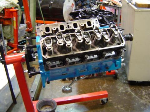 1979 Ford Bronco - Engine block and cylinder head assembly on a stand, with visible valve train components.