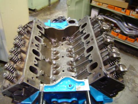 1979 Ford Bronco - Engine block with valve springs and exhaust manifolds visible on a shelf in the background.