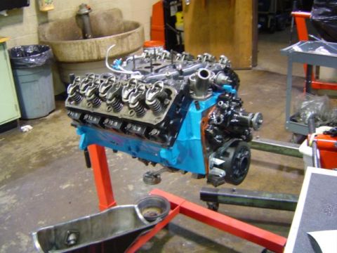 1979 Ford Bronco - Engine assembly on a stand, likely undergoing a rebuild or repair.