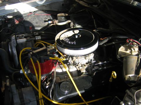 1985 Ford LTD Crown Victoria - V8 engine bay with chrome air cleaner and red distributor cap.