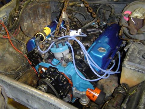1979 Ford Bronco - Engine bay components including blue valve covers and an orange oil filter are visible, with a Supermotors.net watermark in the corner.