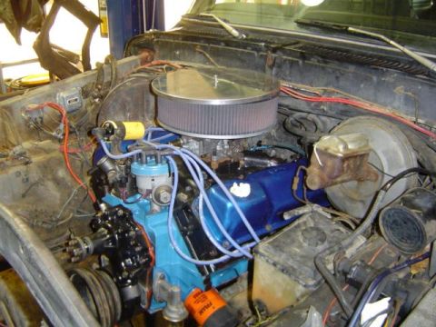 1979 Ford Bronco - Close-up view of a V8 engine in an engine bay, detailing components and wiring.