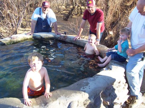 1981 Ford F-150 - Children and adults enjoy time at a pond in a natural, outdoor setting.