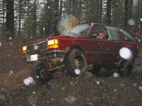 1991 Ford Explorer - This 1991 Ford Explorer is navigating a challenging off-road course in wet conditions.
