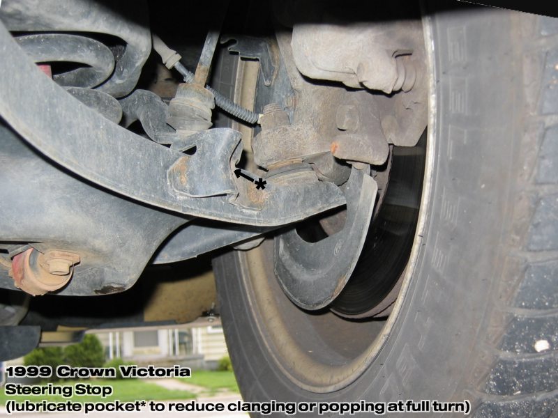 1999 Ford Crown Victoria steering stop assembly with rust and a tire