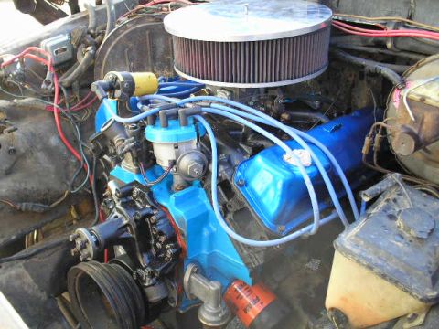 1979 Ford Bronco - Close-up view of an engine bay, showing various components and wiring.