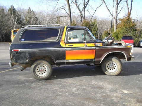 1979 Ford Bronco - Ford Bronco with hood open, two-tone paint job, parked outdoors.