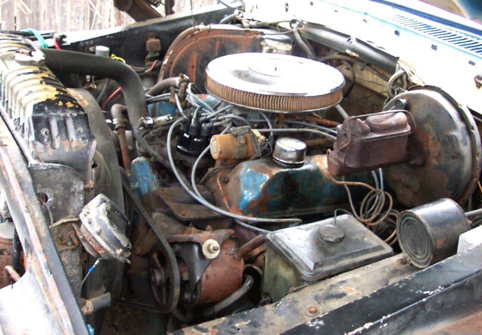 Engine bay with V8 engine, air cleaner, radiator, and brake booster
