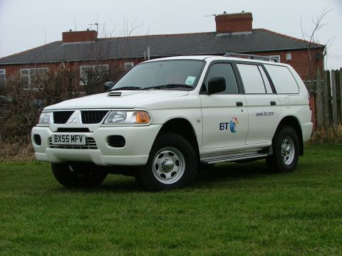 2006 Mitsubishi L200 - White panel van with BT branding is seen from a three-quarter front angle.