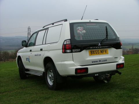 2006 Mitsubishi L200 - White van with BT logo and website on the rear. License plate is BX55 MFV.