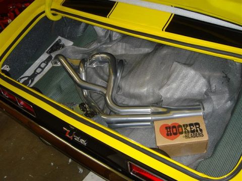 1970 Chevrolet Camaro - The trunk of a yellow 1970 Chevrolet Camaro holds a new Hooker Headers exhaust system.