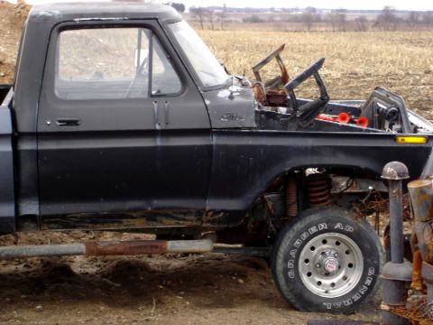 1979 Ford Bronco - This black pickup truck appears to be from the late 1970s, but it is not a Ford Bronco.