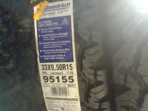 1988 Ford Bronco - Close-up of a Goodrich Terrain T/A KO tire label showing size and part number.