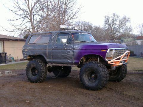 1979 Ford Bronco - This heavily modified Ford Bronco features a custom paint job and oversized tires for off-road use.