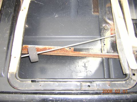 1986 Chevrolet Blazer - Interior view of the tailgate area of a 1986 Chevrolet Blazer, showing the window mechanism components.