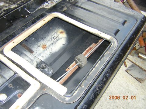 1986 Chevrolet Blazer - Close-up of a tailgate interior, showing a removed window frame and signs of rust.