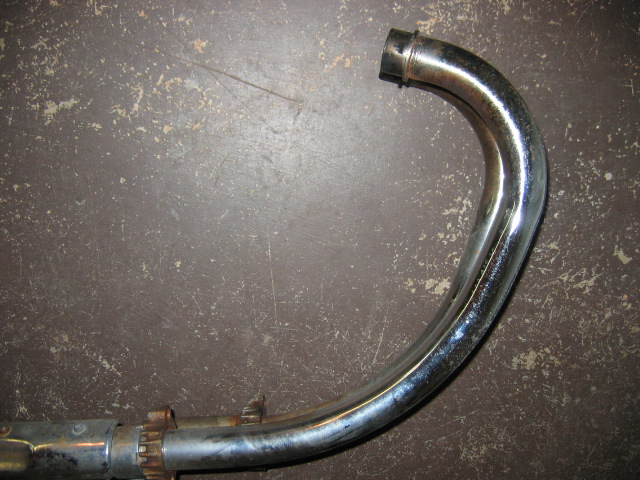 Chrome exhaust pipe with a curved section and a flange