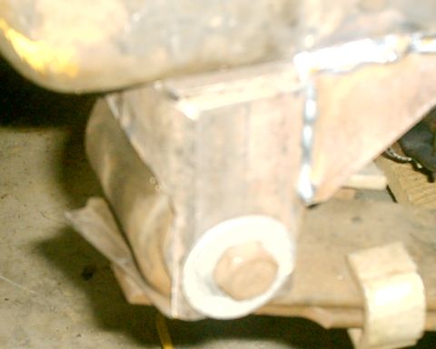 1985 Ford Bronco - Close-up view of a vehicle's suspension component, showing a bolt and welded metal.