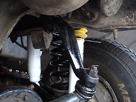 1994 Ford Bronco - Front suspension components of a 1994 Ford Bronco, including shocks and springs.