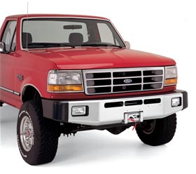 1991 Ford Bronco - Front view of a red Ford truck with a chrome grille and bumper.