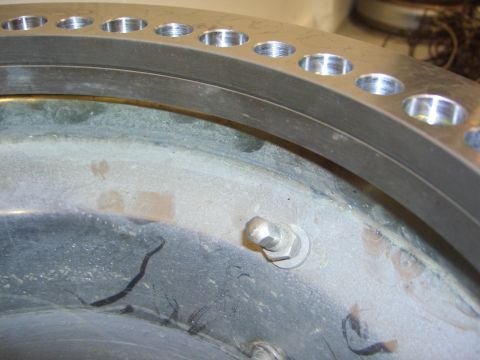 1996 Ford Bronco - A close-up view of a vehicle's wheel hub assembly, showing wear and tear.