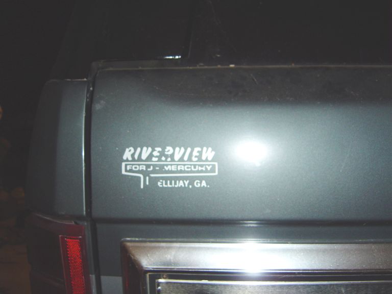 Rear quarter panel of a vehicle showing a 'Riverview for J-Mercury Ellijay, GA' decal