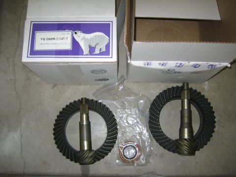 1994 Ford Bronco - Differential gears and associated parts are shown, including boxes with a polar bear graphic and part number YG D60R-535R-1.