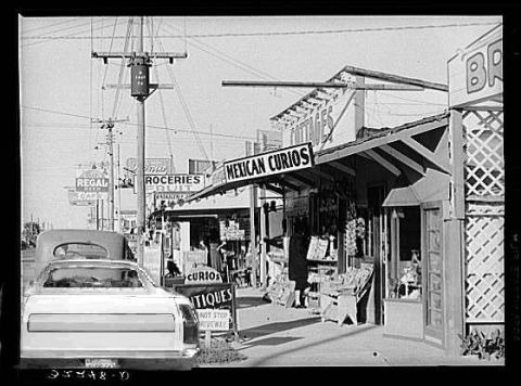 1979 Ford Ranchero - Street scene with shops and a pickup truck in the foreground.