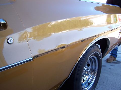 1973 Ford Ranchero - First shot of dent with trim removed. 75% of dent already hammered out at this point.