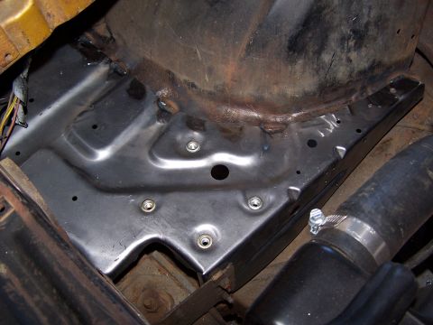 1973 Ford Ranchero - This image shows a section of metalwork within a vehicle's engine compartment, likely a component of the inner fender well or firewall.