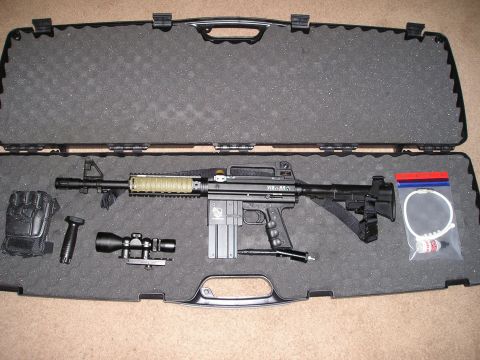 1986 Ford Bronco II - A paintball gun and its accessories are neatly organized inside a protective case.