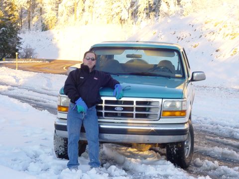 1995 Ford Bronco - Me and the Bronco in the snow. (The pic makes me look taller than I am.)