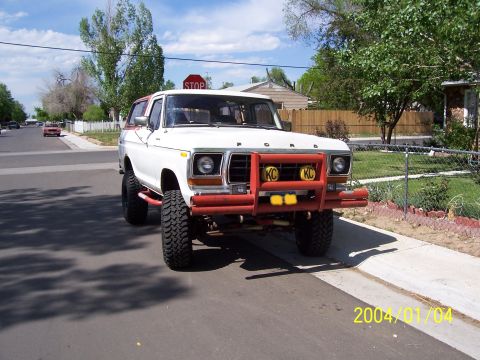 1978 Ford Bronco - This 1978 Ford Bronco is parked on the street, showing its front end and custom bumper.