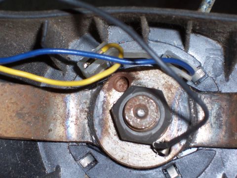 1978 Ford Bronco - Wiring harness connection with blue and yellow wires attached to a metal bracket.
