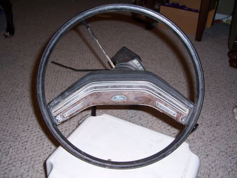 1978 Ford Bronco - This steering wheel has a Ford logo and wood grain accents, but it's not definitively from a 1978 Bronco.