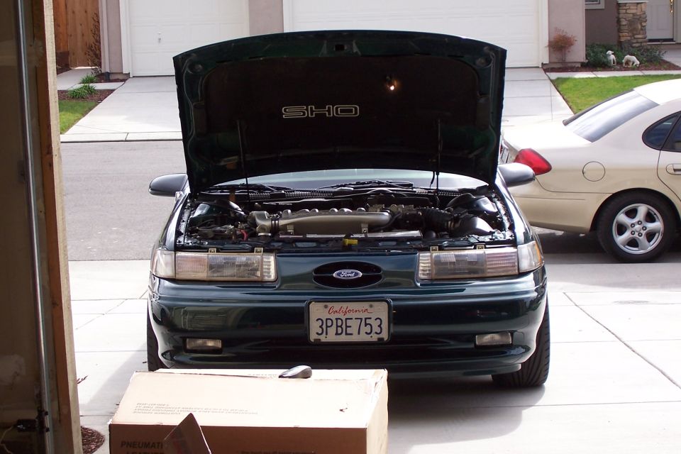1998 Ford SHO front view, hood open, showing engine. Green exterior