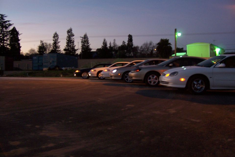 White 1998 Mercury Sable parked in a line of cars