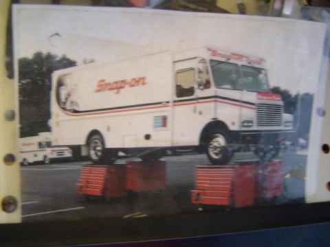 1979 Ford Bronco - Snap-on tool truck is elevated on red tool chests, with another truck visible behind it.