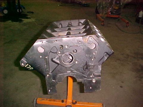 1967 Ford Galaxie - An engine block is shown mounted on an orange stand, with the number "178" visible on its surface.