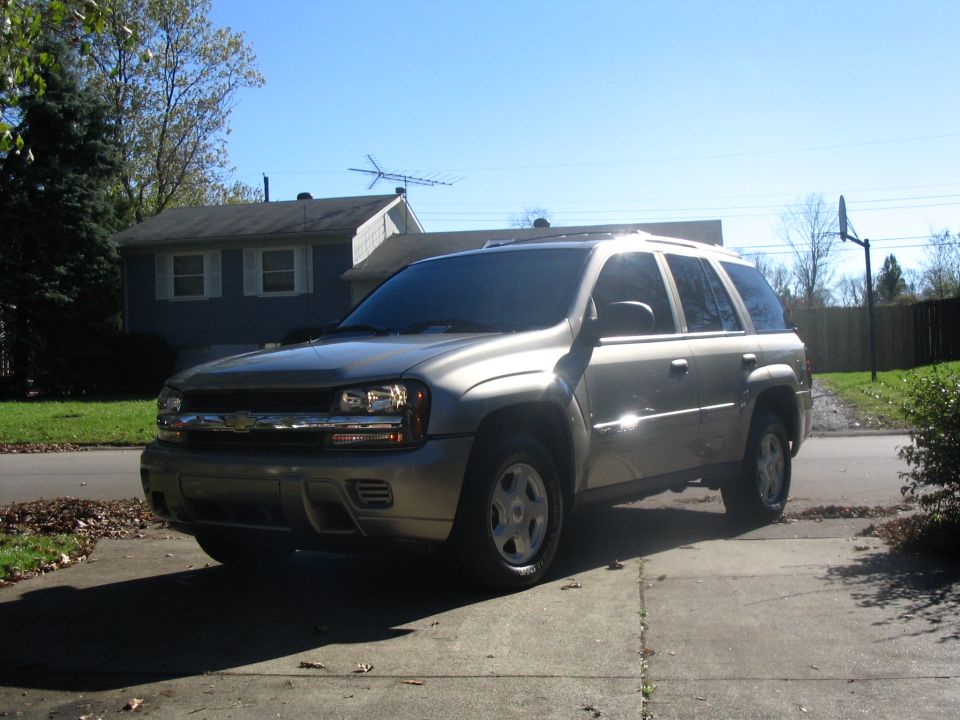 Tan Chevrolet TrailBlazer SUV parked on a driveway, front three-quarter view
