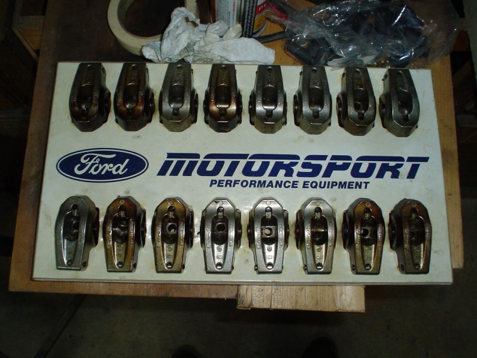 Ford Motorsport rocker arms displayed on a white board with blue lettering