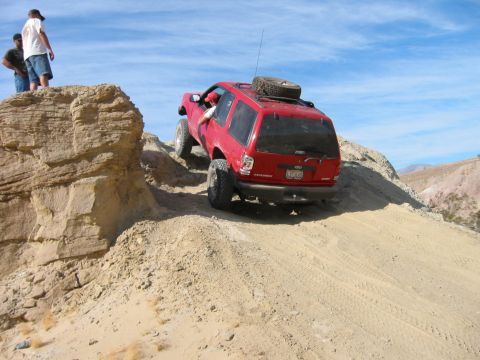 1997 Ford Ranger - Off-roading in a red Ford Explorer on a desert trail.