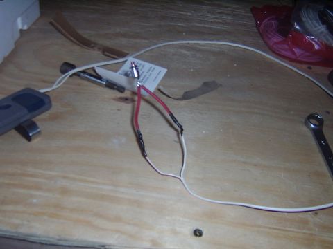 1998 Jeep TJ - Close-up view of electrical wiring and a tool on a wooden surface.