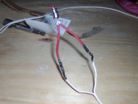 1998 Jeep TJ - Close-up of a red LED connected to electrical wires, with a screwdriver bit visible in the background.