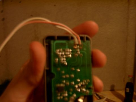 1998 Jeep TJ - Close-up of a car key fob's internal circuit board with wires attached.