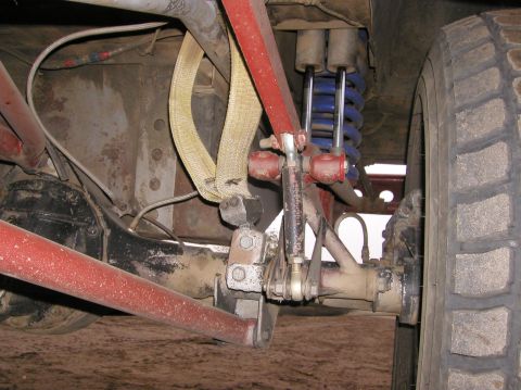 1984 Ford Bronco - Off-road vehicle rear suspension components, including shocks and control arms, are visible.