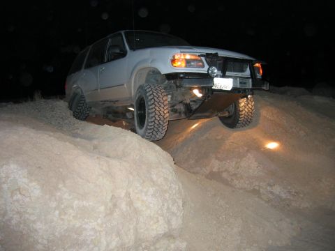 1997 Ford Ranger - This modified SUV navigates a challenging off-road course under the cover of darkness.