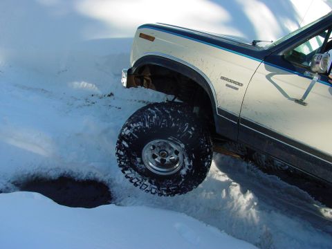 1986 Ford Bronco - 1986 Ford Bronco navigating snowy terrain.